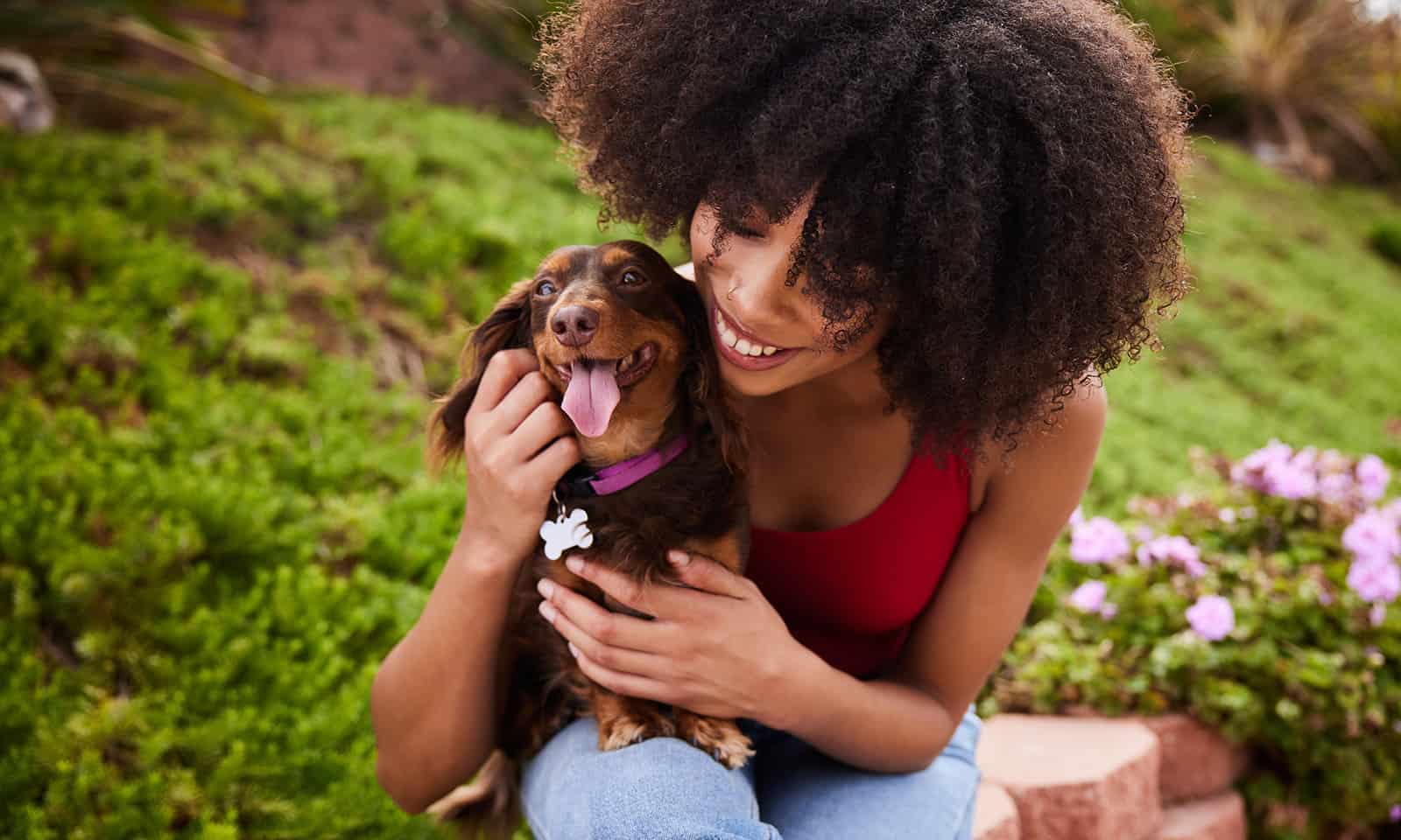 A woman hugging her dog